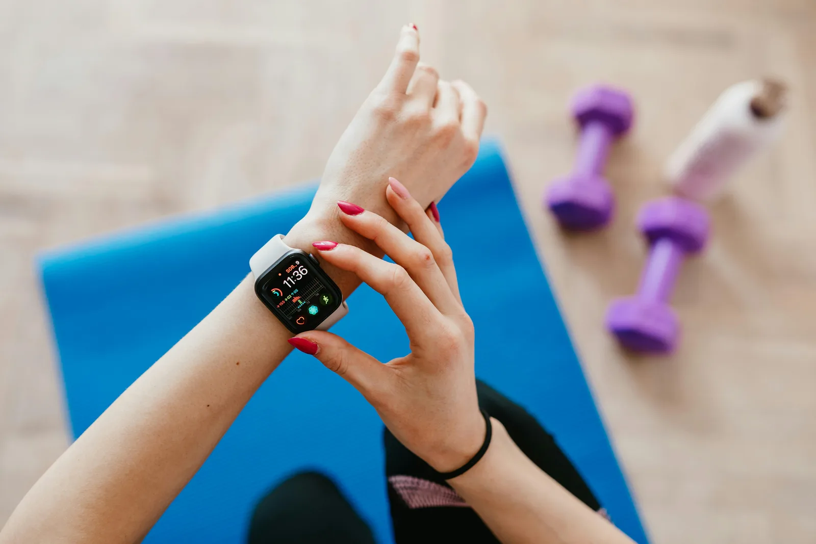 Person checking a fitness tracker during everyday use