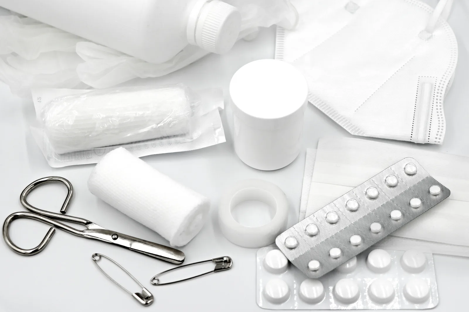 Organized home health supplies with basic monitoring tools and first aid items